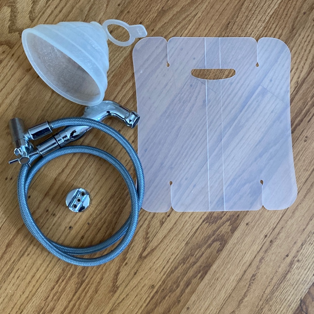 Diaper sprayer and shield or handheld bidet hose/sprayer